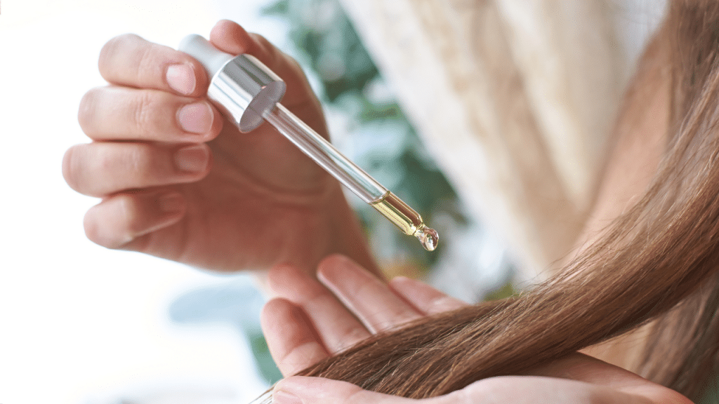 applying lightweight layer of hair oil